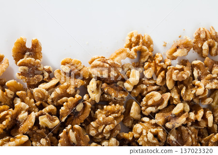 Dry peeled walnut in glass bowl on white background, nobody Dry peeled walnut in glass bowl on white background, nobody 137023320