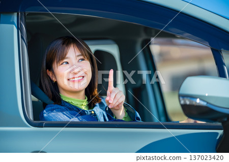 A woman driving a car A woman driving a car 137023420