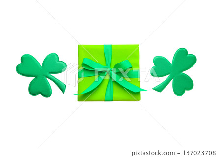 Green gift box with ribbon and shamrocks, isolated, PNG Green gift box with ribbon and shamrocks, isolated, PNG 137023708