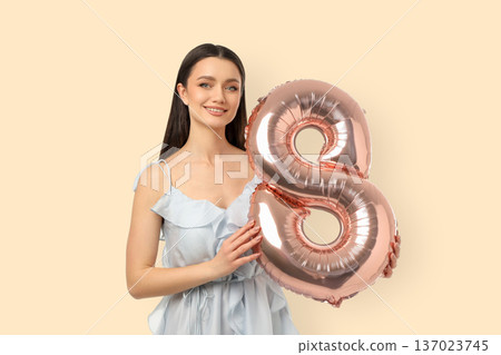 Woman with balloon is celebrating International Women's Day 137023745
