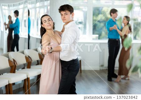 Couple young woman and man dancing waltz 137023842