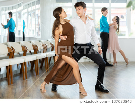 Couple young woman and man dancing latin dances 137023843