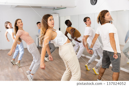 Group of different people rehearsing dance in dance studio 137024052