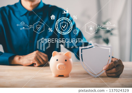 Man holds shield to protect piggy bank money, save with saving plan, financial insurance and finance, digital cybersecurity protection for wealth, asset storage and growth 137024329