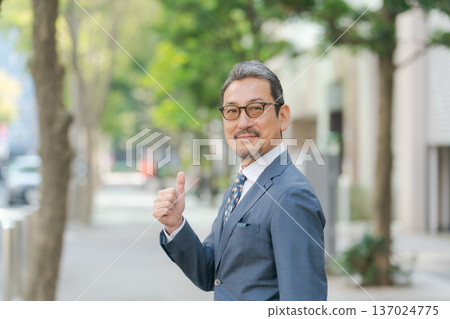 A businessman in his 50s making a fist pump 137024775