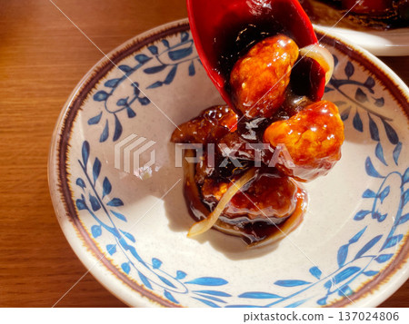 Sweet and sour pork: A Chinese dish with a sweet and sour sauce. Sweet and sour pork: A Chinese dish with a sweet and sour sauce. 137024806