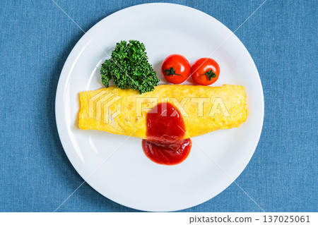 Omurice: A classic Western dish of fluffy eggs topped with ketchup Omurice: A classic Western dish of fluffy eggs topped with ketchup 137025061