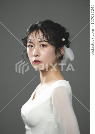 Bride wearing a wedding dress Bride wearing a wedding dress 137025243