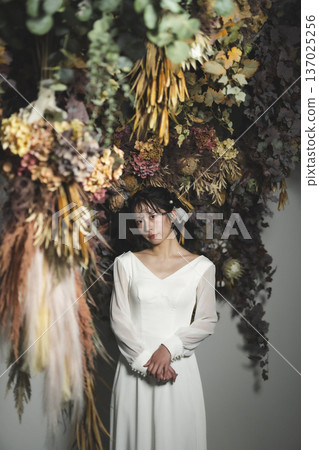 Bride wearing a wedding dress Bride wearing a wedding dress 137025256