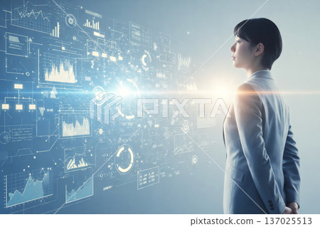 一位商務人士正在操作和分析全像資料面板 137025513