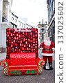 Santa figure with red sofa and holiday ornament wall outdoor display 137025602
