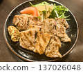 Restaurant-style thick-sliced pork steak served with vegetable salad and whole grain mustard 137026048