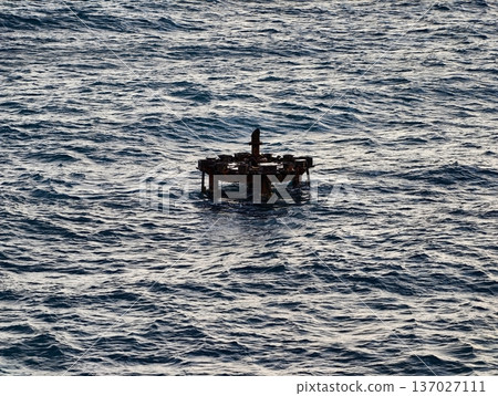 Weathered platform amid ocean waves, Nautical survey site with aged metal and ocean backdrop 137027111