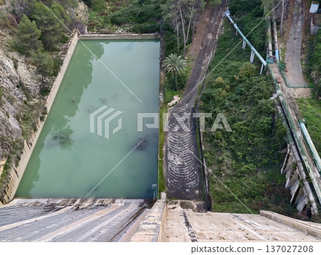 Drone captures infrastructure, Aerial view of dam features, Highangle shot of spillway structure Drone captures infrastructure, Aerial view of dam features, Highangle shot of spillway structure 137027208