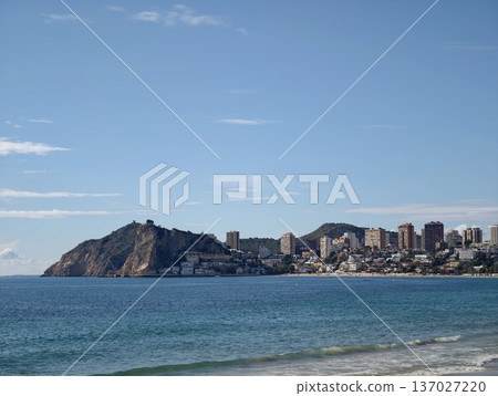 Coastal town scene, Picturesque coastal community featuring rocky promontories and azure waters 137027220