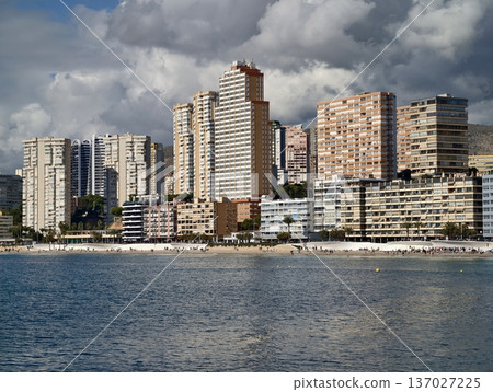 Urban waterfront with vibrant scenery, Coastal urban horizon featuring towers and calm waters Urban waterfront with vibrant scenery, Coastal urban horizon featuring towers and calm waters 137027225