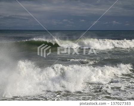 Chaotic storm sea, Fierce ocean turmoil captured through crashing waves and turbulent weather Chaotic storm sea, Fierce ocean turmoil captured through crashing waves and turbulent weather 137027383