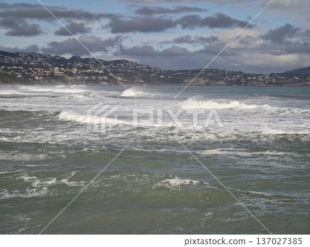 Serene seaside scene, Quiet shoreline horizon featuring rolling waters and muted sky colors Serene seaside scene, Quiet shoreline horizon featuring rolling waters and muted sky colors 137027385
