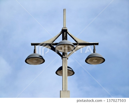 Minimalist pole with four lights, Contemporary corridor lighting featuring clean lines and four fixtures Minimalist pole with four lights, Contemporary corridor lighting featuring clean lines and four fixtures 137027503