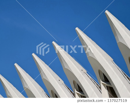 Minimalist composition showcases sharpedged fins and futuristic roofline in contemporary civic setting 137027519