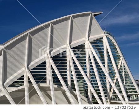 Modern urban environment combines rhythmic structures and reflective elements for visual interest Modern urban environment combines rhythmic structures and reflective elements for visual interest 137027529