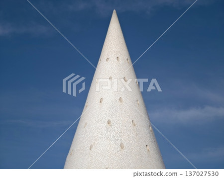 Contemporary sculpture featuring subtle textures and geometric elegance extending towards horizon Contemporary sculpture featuring subtle textures and geometric elegance extending towards horizon 137027530
