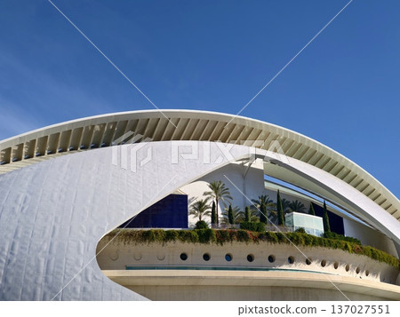 Elegant modern architecture, Smooth white exterior with circular windows and lush greenery surrounding 137027551