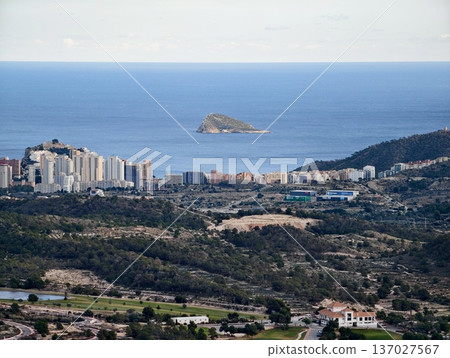 Serene seaside settlement, Picturesque shoreline location boasting azure waters and gentle hills 137027567