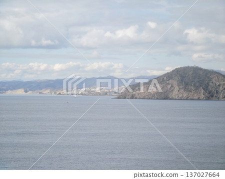 Mountainsheltered bay views, Peacful port setting framed by distant mountains and gentle waters 137027664