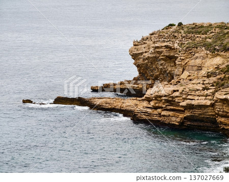 Rocky coastal landscape, Stony seaside escarpment intersecting turbulent waters offers research opportunity 137027669