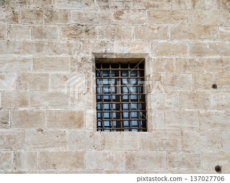 Ancient stone window, Historic masonry with niche, Weathered stone wall features small 137027706