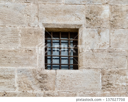 Ancient stone window, Historic masonry with niche, Weathered stone wall features small niche window 137027708