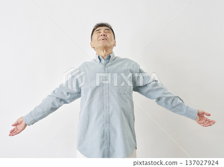 Man taking a deep breath on white background Man taking a deep breath on white background 137027924