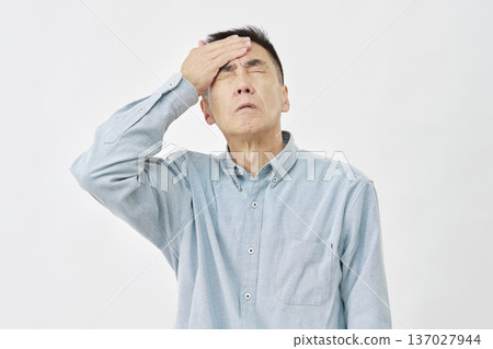 A man with a fever on a white background A man with a fever on a white background 137027944