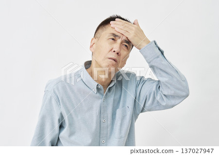 A man with a fever on a white background A man with a fever on a white background 137027947