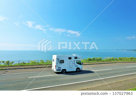 Hokkaido Camping car running along the road along the sea with blue skies Hokkaido Camping car running along the road along the sea with blue skies 137027963