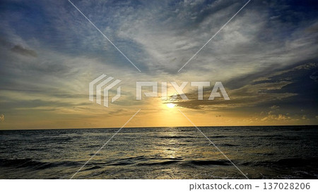 Golden Sunset over the Ocean Horizon 137028206