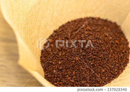 paper filter and coffee grounds paper filter and coffee grounds 137028340
