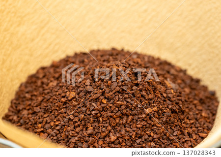 paper filter and coffee grounds paper filter and coffee grounds 137028343