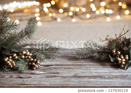 Christmas background with branches of a christmas tree on a wooden table copy space. Christmas background with branches of a christmas tree on a wooden table copy space. 137030219