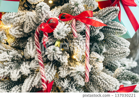 Christmas candies on a Christmas tree, close-up. Christmas candies on a Christmas tree, close-up. 137030221