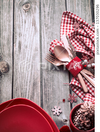 Christmas dinner cutlery with decor on a wooden background 137030296