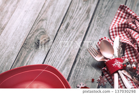 Christmas dinner cutlery with decor on a wooden background 137030298