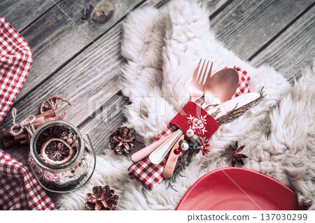 Christmas dinner cutlery with decor on a wooden background Christmas dinner cutlery with decor on a wooden background 137030299