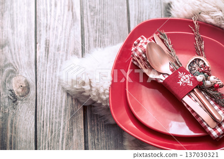 Christmas dinner cutlery with decor on a wooden background 137030321