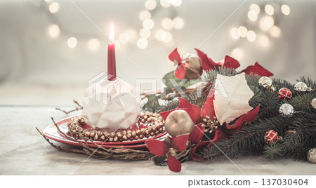 Christmas holiday background with a candle in a candlestick. 137030404