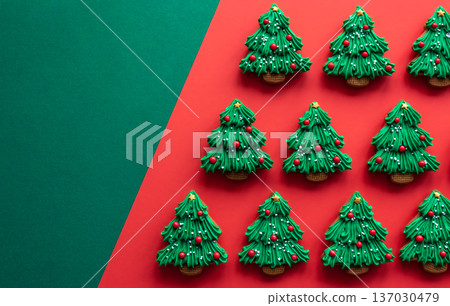 Christmas tree shaped gingerbread cookies covered with icing, flat lay. 137030479