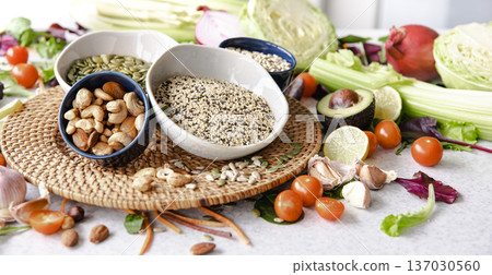 Close-up, a bowl of chia seeds and other healthy foods on the kitchen table. 137030560