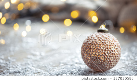 Festive background with Christmas ball and blurred bokeh lights, copy space. 137030593