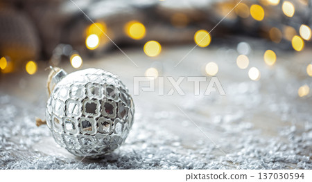 Festive background with Christmas ball and blurred bokeh lights, copy space. 137030594